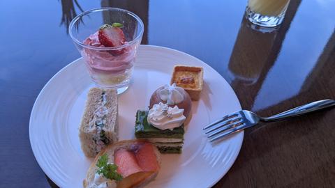 Afternoon tea with cakes and sandwiches
