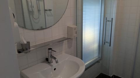 Clean bathroom vanity and shower booth
