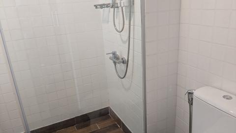 Shower booth and toilet in the bathroom