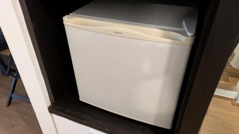 Of course, a refrigerator is included.